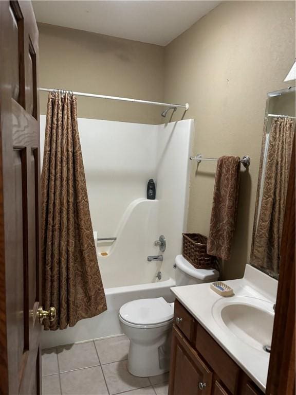 bathroom featuring toilet, shower / tub combo with curtain, tile patterned flooring, and vanity