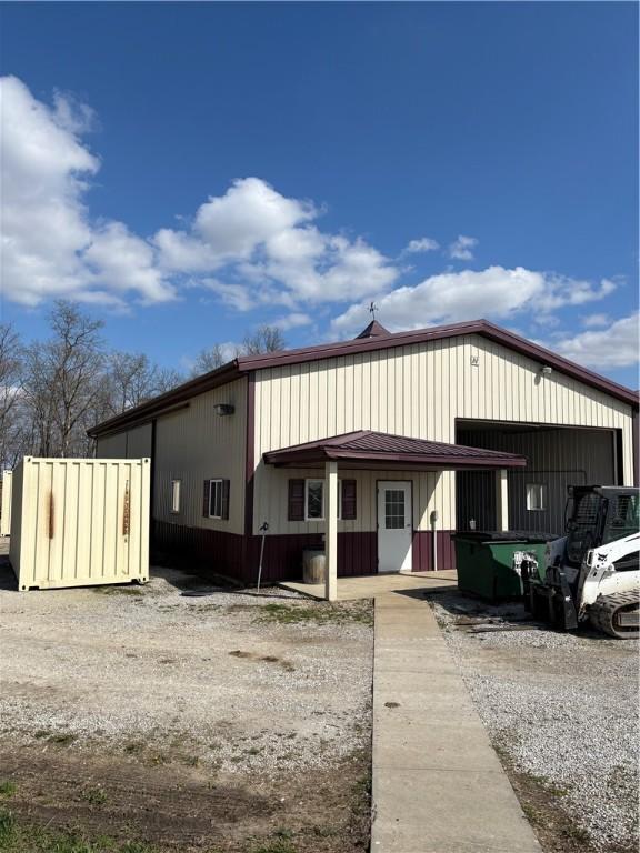 view of front of home featuring a standing seam roof, metal roof, and a garage