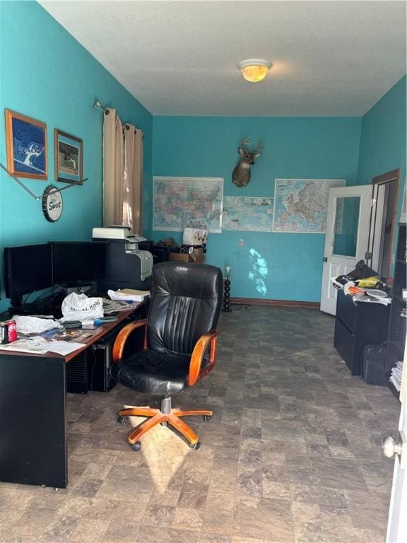 home office with stone finish floor