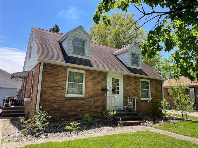 3117 Oak Ave, Mattoon, IL 61938 - cape cod-style house featuring brick siding and roof with shingles