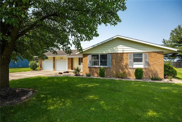 1009 Henrietta St, Effingham, IL 62401 - ranch-style house with a garage, concrete driveway, a front yard, and brick siding