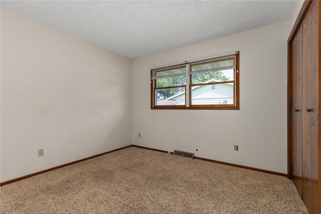1009 Henrietta St, Effingham, IL 62401 - unfurnished bedroom with light carpet and a closet