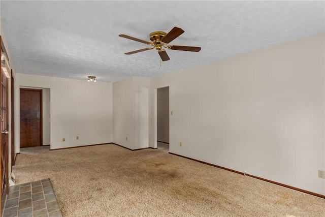 1009 Henrietta St, Effingham, IL 62401 - carpeted empty room featuring a ceiling fan and baseboards