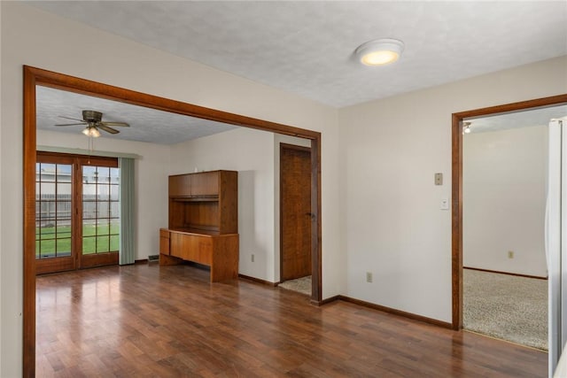 1009 Henrietta St, Effingham, IL 62401 - unfurnished living room with dark wood-type flooring and a ceiling fan