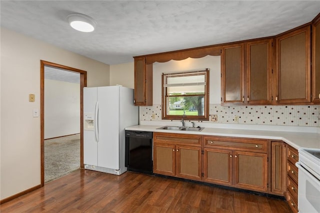 1009 Henrietta St, Effingham, IL 62401 - kitchen with white appliances, brown cabinets, light countertops, backsplash, and a textured ceiling