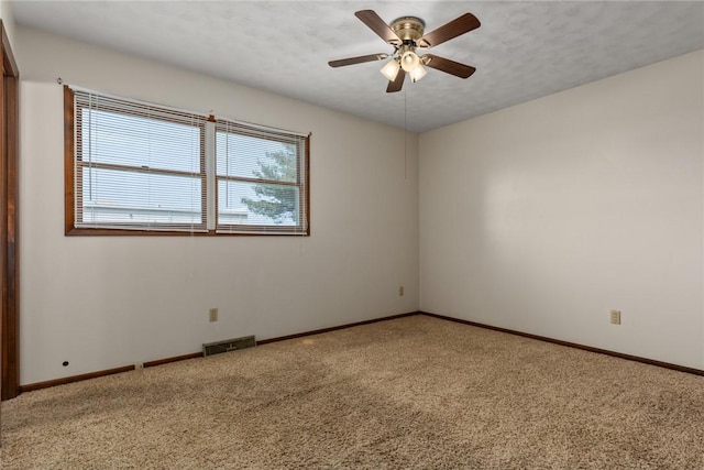 1009 Henrietta St, Effingham, IL 62401 - carpeted spare room featuring plenty of natural light and a ceiling fan