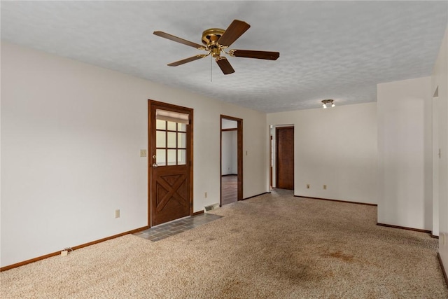1009 Henrietta St, Effingham, IL 62401 - carpeted empty room with baseboards and a ceiling fan