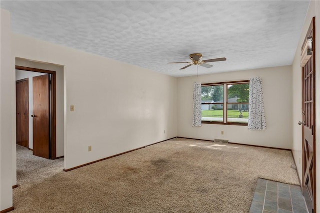 1009 Henrietta St, Effingham, IL 62401 - carpeted empty room with a ceiling fan and a textured ceiling