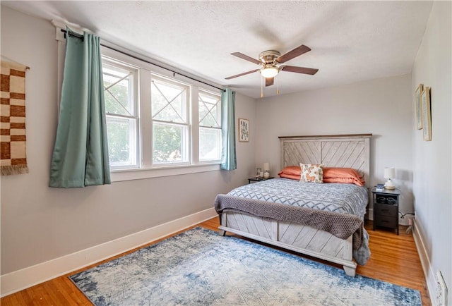 1440 W Decatur St, Decatur, IL 62522 - bedroom with wood finished floors and ceiling fan