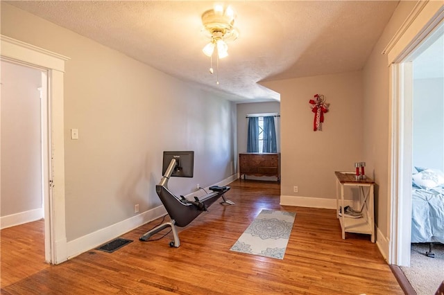1440 W Decatur St, Decatur, IL 62522 - sitting room featuring wood finished floors, a ceiling fan, and a textured ceiling
