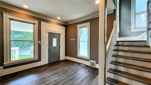 foyer entrance featuring dark hardwood / wood-style floors and ornamental molding