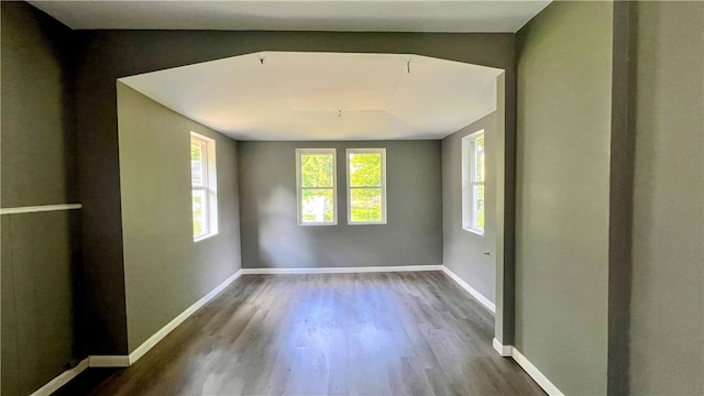 unfurnished room with hardwood / wood-style floors