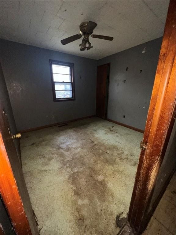 902 N Robb St, Robinson, IL 62454 - unfurnished room with baseboards and ceiling fan