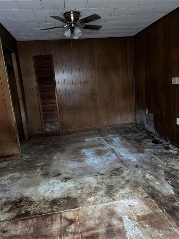 902 N Robb St, Robinson, IL 62454 - unfurnished room with a ceiling fan and wooden walls