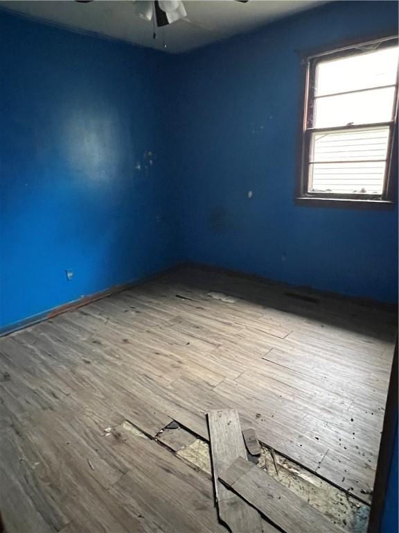 902 N Robb St, Robinson, IL 62454 - empty room with a ceiling fan and wood finished floors