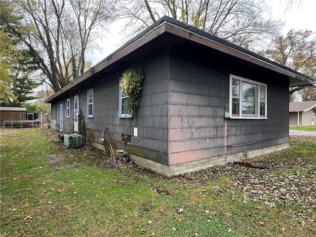 902 N Robb St, Robinson, IL 62454 - view of property exterior featuring a central air condition unit and a yard