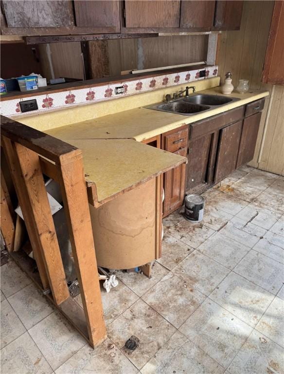 kitchen featuring light countertops and a sink