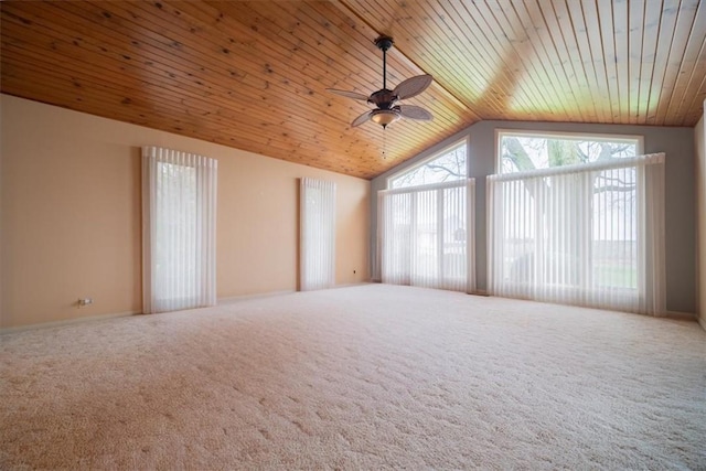 carpeted spare room with ceiling fan, wood ceiling, and lofted ceiling