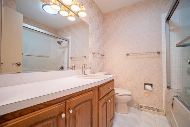 full bathroom with tile patterned floors, vanity, toilet, and combined bath / shower with glass door