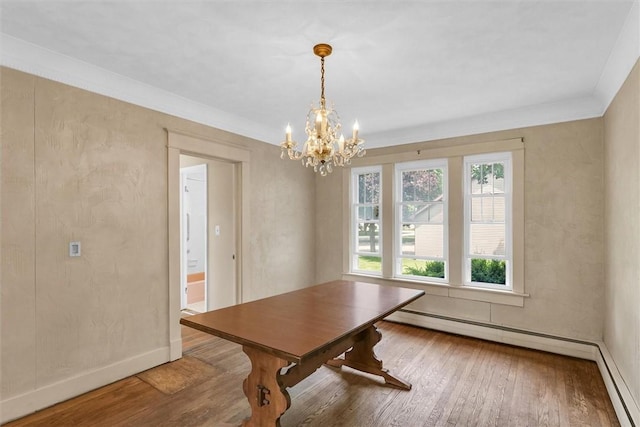 3920 Western Ave, Mattoon, IL 61938 - dining area featuring wood finished floors, a chandelier, and ornamental molding