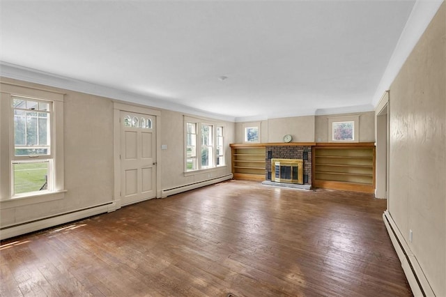 3920 Western Ave, Mattoon, IL 61938 - unfurnished living room featuring a baseboard radiator, hardwood / wood-style flooring, a fireplace, and ornamental molding