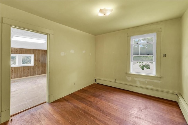 3920 Western Ave, Mattoon, IL 61938 - spare room featuring wood-type flooring and baseboard heating