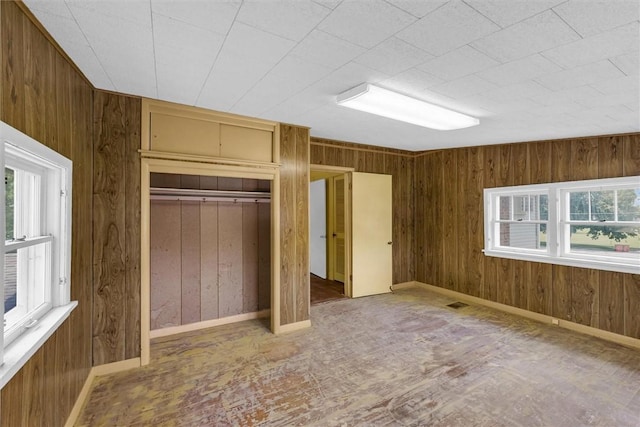3920 Western Ave, Mattoon, IL 61938 - unfurnished bedroom featuring wooden walls and a closet
