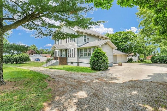 3920 Western Ave, Mattoon, IL 61938 - view of front facade with concrete driveway, a front yard, and a garage