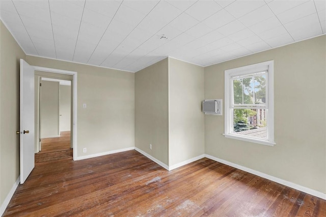 3920 Western Ave, Mattoon, IL 61938 - empty room with hardwood / wood-style flooring and a wall mounted air conditioner