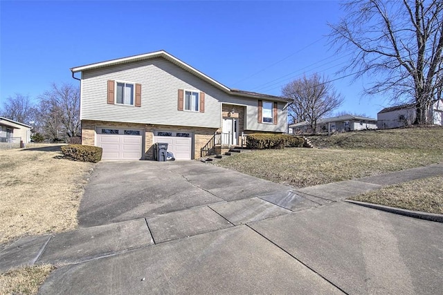 view of front of home featuring driveway and a garage