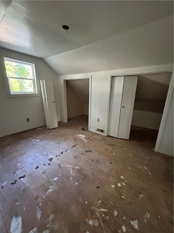 additional living space featuring vaulted ceiling