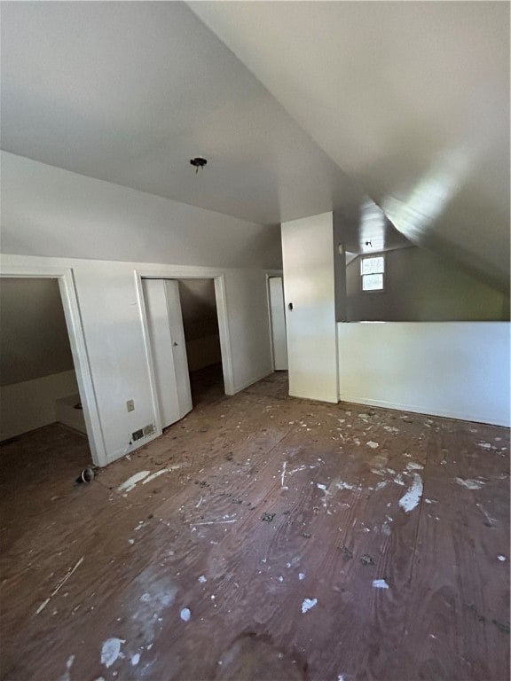 additional living space featuring vaulted ceiling