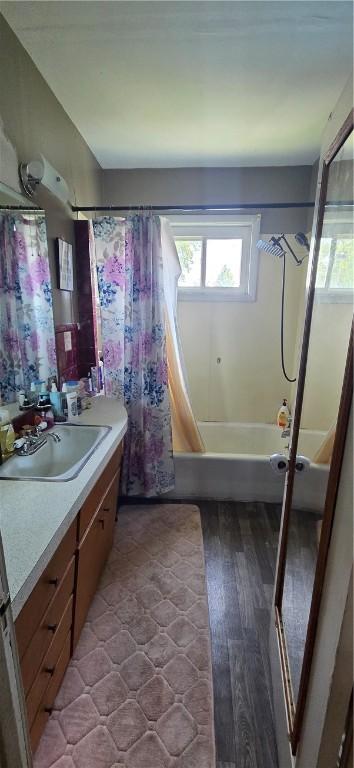 1821 Essex Ave, Mattoon, IL 61938 - bathroom with vanity, shower / tub combo, and wood finished floors