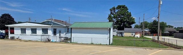 1821 Essex Ave, Mattoon, IL 61938 - view of front of property with a metal roof and uncovered parking