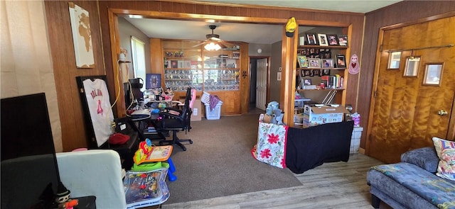 1821 Essex Ave, Mattoon, IL 61938 - office area featuring a ceiling fan, built in shelves, wood finished floors, and wooden walls