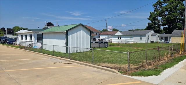 1821 Essex Ave, Mattoon, IL 61938 - view of side of home featuring a metal roof and uncovered parking