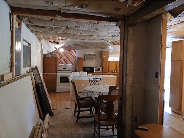 dining area featuring a wall mounted AC