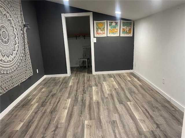 118AND116 Cumberland St, Greenup, IL 62428 - empty room with wood finished floors, lofted ceiling, and baseboards