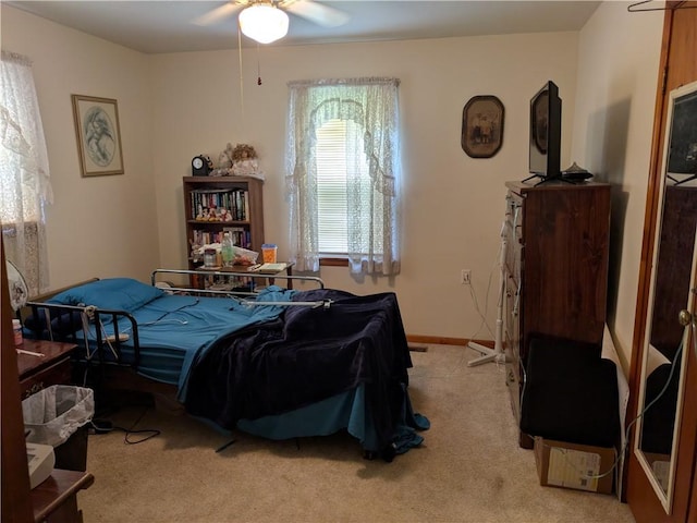 409 E Adams St, Paris, IL 61944 - carpeted bedroom with a ceiling fan and baseboards
