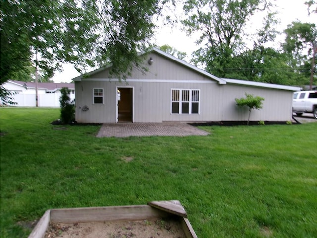2004 Hayes Ave, Charleston, IL 61920 - rear view of house featuring a yard and a patio area