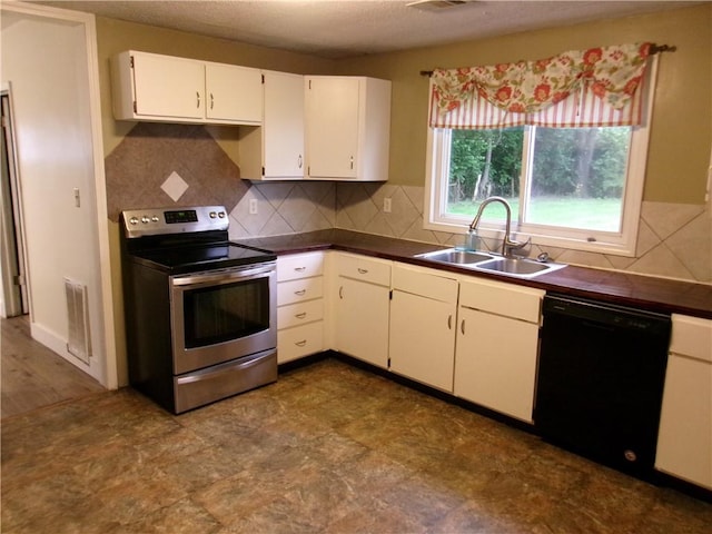 2004 Hayes Ave, Charleston, IL 61920 - kitchen featuring stainless steel electric range oven, dishwasher, a sink, and dark countertops