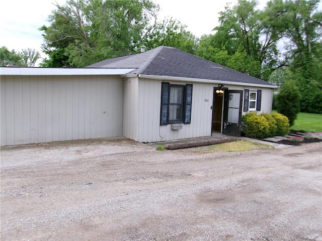 2004 Hayes Ave, Charleston, IL 61920 - ranch-style home with roof with shingles and driveway
