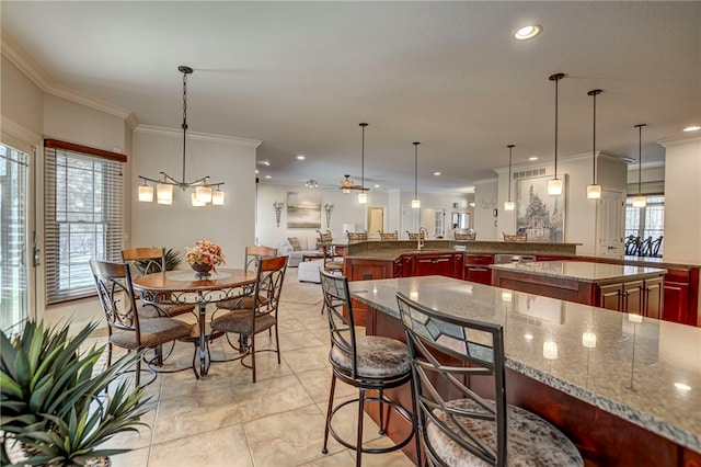 dining room with plenty of natural light, recessed lighting, and ornamental molding