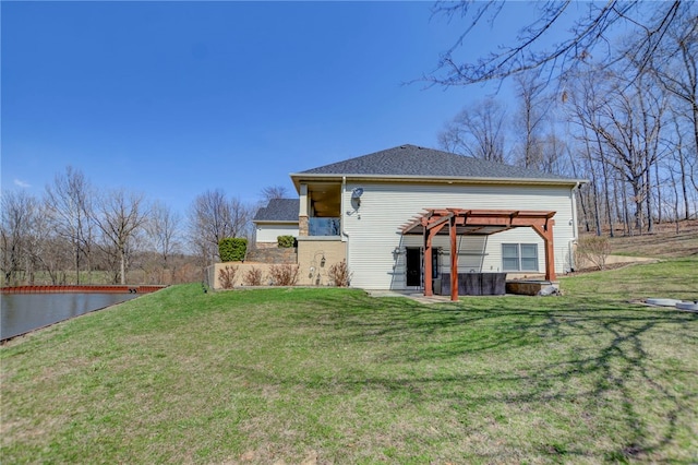 back of property with a pergola, a lawn, and a patio