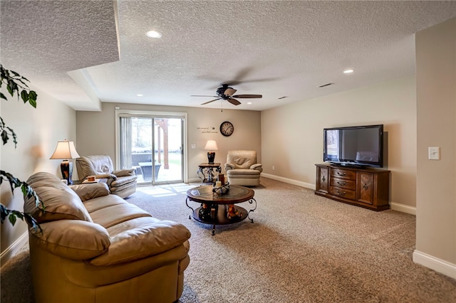 carpeted living room with recessed lighting, a textured ceiling, baseboards, and ceiling fan