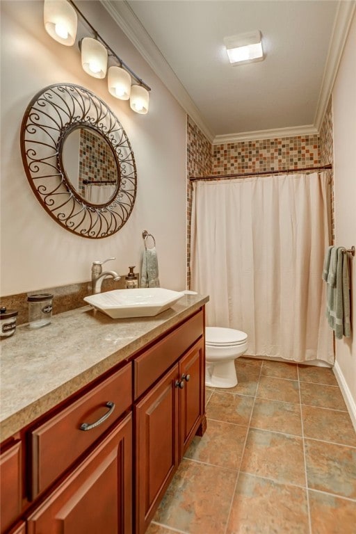bathroom with ornamental molding, toilet, vanity, and a shower with curtain