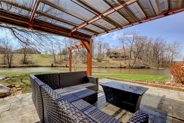view of patio / terrace featuring an outdoor hangout area and a water view