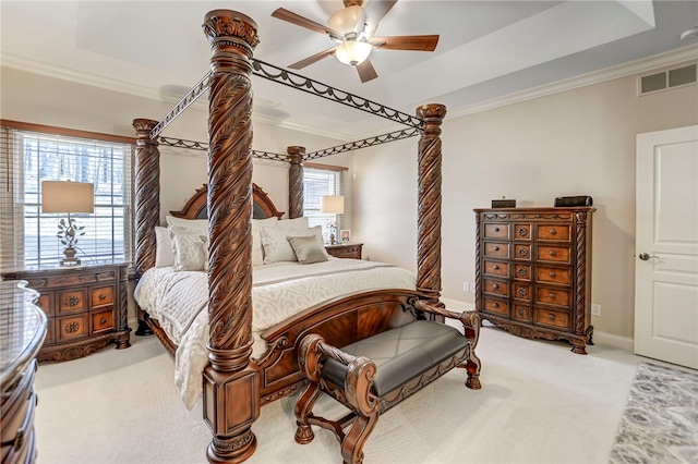 bedroom featuring ornamental molding, multiple windows, and visible vents
