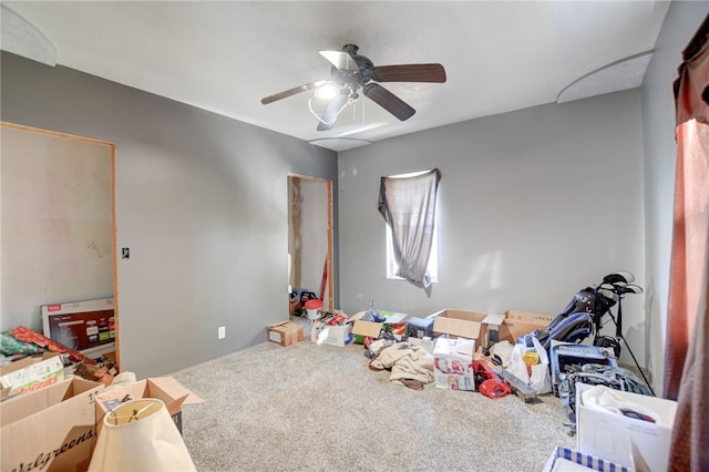 rec room with ceiling fan and carpet floors