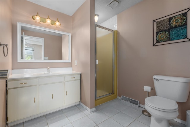 bathroom featuring tile patterned flooring, vanity, a textured ceiling, and walk in shower